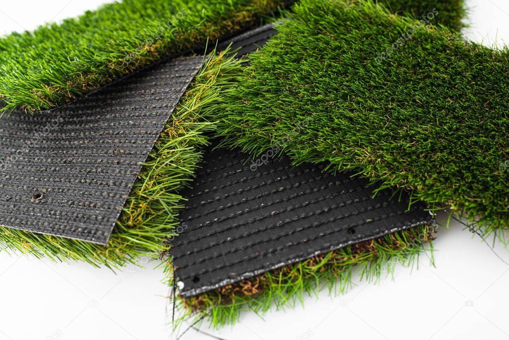 Detail of types of artificial grass in a sample book.