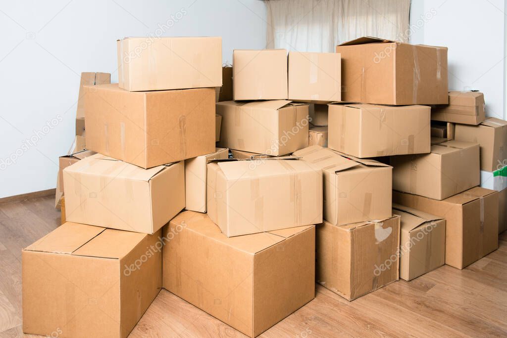 Family loses their home and moves, fills the cardboard boxes for the move due to the crisis.