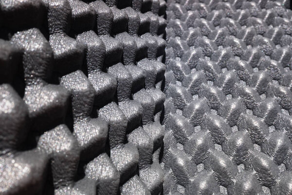 Крупный план структуры полиуретанового акустического изолятора.