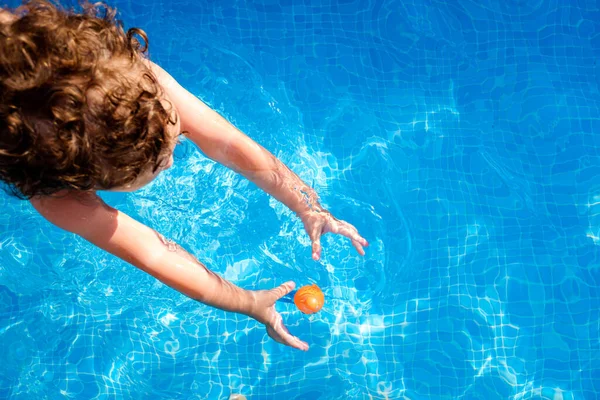 Baby Swims Pool Trying Reach Toy Water Top View Summer — Stock Photo, Image