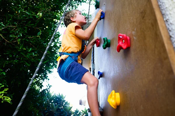 Boy Playing Climbing Climbing Wall His Yard Secured Harness Rope — Stock Photo, Image