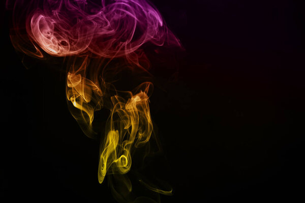 Colored smoke isolated on black background