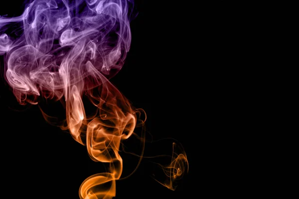 Colored smoke isolated on black background — Stock Photo, Image