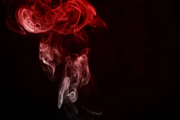 Red smoke on black background — Stock Photo, Image