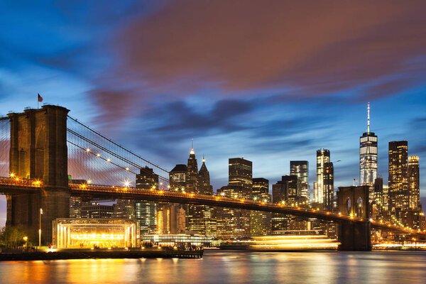 New York City Manhattan Downtown with Brooklyn Bridge at Dusk