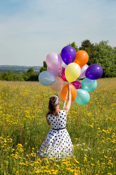 Visão Traseira Alfinete Menina Com Petticoat Balões Coloridos Prado Florido — Fotografia de Stock