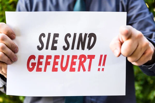 Zakenman Houdt Een Krant Vast Met Duitse Tekst Sie Sind — Stockfoto