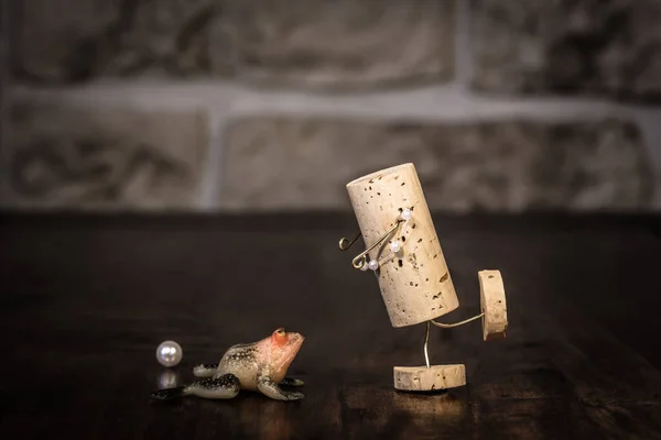 Concept frog prince fairytale with wine cork figure