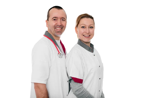 Duas Enfermeiras Sorrindo Para Espectador Isoladas Branco — Fotografia de Stock