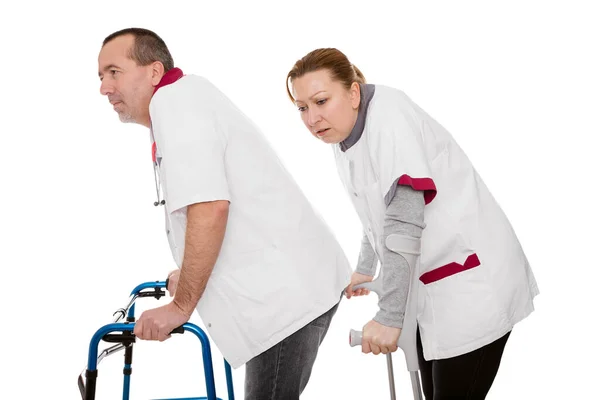 Two Revised Nurses Limping Isolated White — Stock Photo, Image