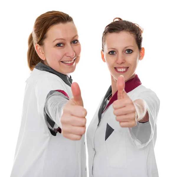 Twee Vrouwelijke Verpleegsters Met Energie Succes Geïsoleerd Wit — Stockfoto