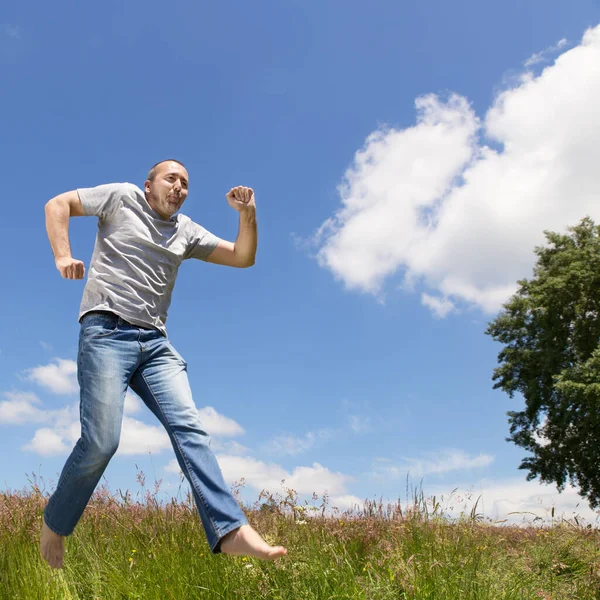 Man Jumping Front Blue Sky — Stock Photo, Image