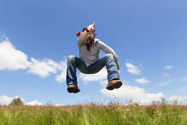 Man Beard Jumping Points Something — Stock Photo, Image