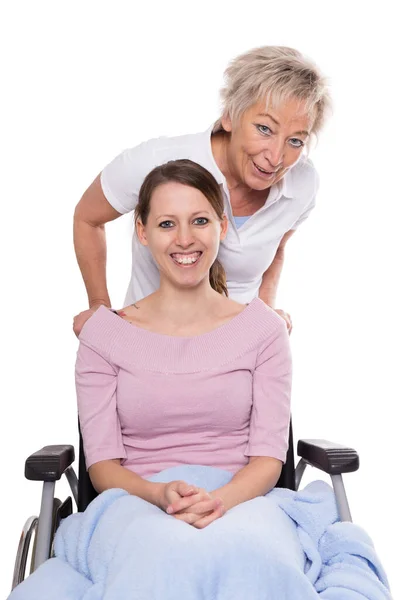 Jovem Mulher Cadeira Rodas Enfermeira Idosa Atrás Dela Isolado Branco — Fotografia de Stock