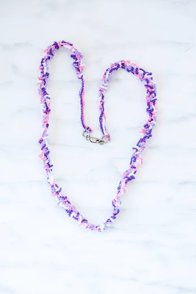 Crocheted pink and purple necklace