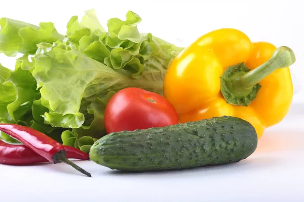 Assorted vegetables, fresh bell pepper, tomato, chilli pepper, cucumber and lettuce isolated on white background. Selective focus. — Stock Photo, Image