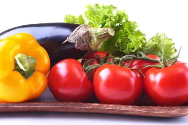 Fresh assorted vegetables, eggplant, bell pepper, tomato, garlic with leaf lettuce. Isolated on white background. Selective focus. — Stock Photo, Image