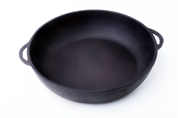 Новая, чистая и пустая чугунная сковорода для гриля . — стоковое фото