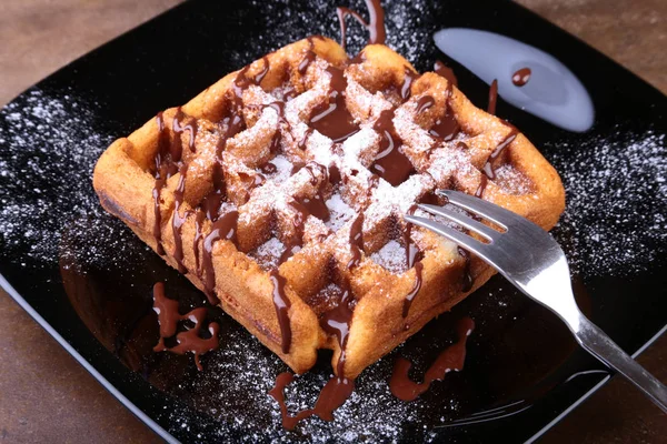 Black plate with homemade belgian waffles with Sifting sugar powder. — Stock Photo, Image