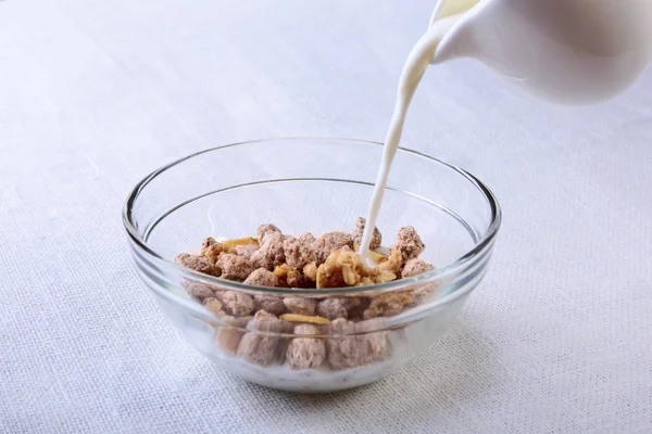 Healthy food with Corn Flakes cereal in a bowl, apple, banana and glass with milk. Morning breakfast. — Stock Photo, Image