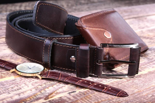 Watch, leather belt and wallet, bottle with cologne on wooden background. Stylish mens business accessories. — Stock Photo, Image