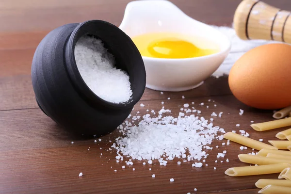 Egg, flour, salt, ingredients for pasta penne bolognese — Stock Photo, Image