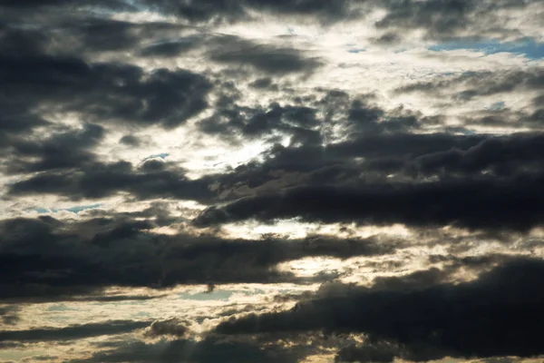 Colorful dramatic sky with clouds at sunset. Stock Image