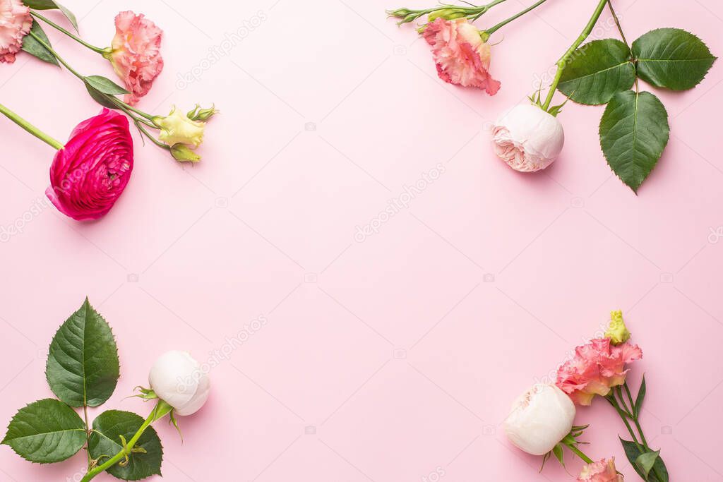 Pink and white flower bouquet on pink background with copyspace top view