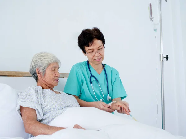 Senior Nurse Take Care Elderly Woman Laying Hospital Bed — Stock Photo, Image