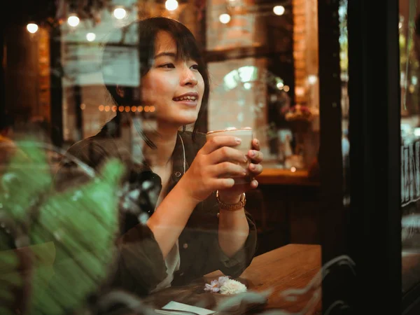 stock image Asian woman drinking coffee in  coffee shop cafe  