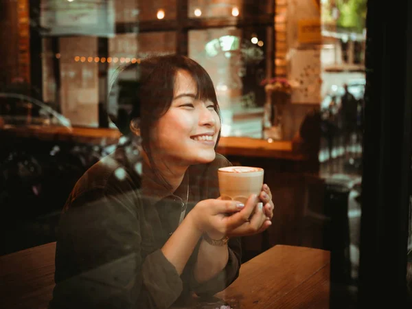 Asian woman drinking coffee in  coffee shop cafe — Stock Photo, Image