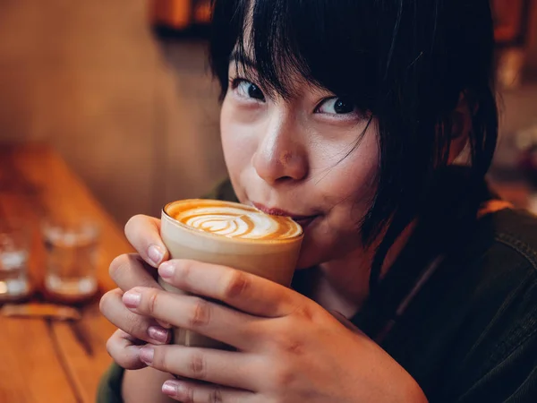 Asian woman drinking coffee in  coffee shop cafe — Stock Photo, Image