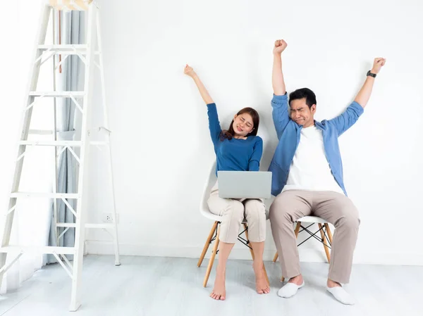 Asian Man and Woman talking boring and sleepy with laptop comput