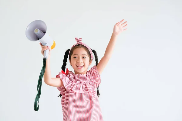 Asian cute girl with megaphone singing on white background — Stock Photo, Image