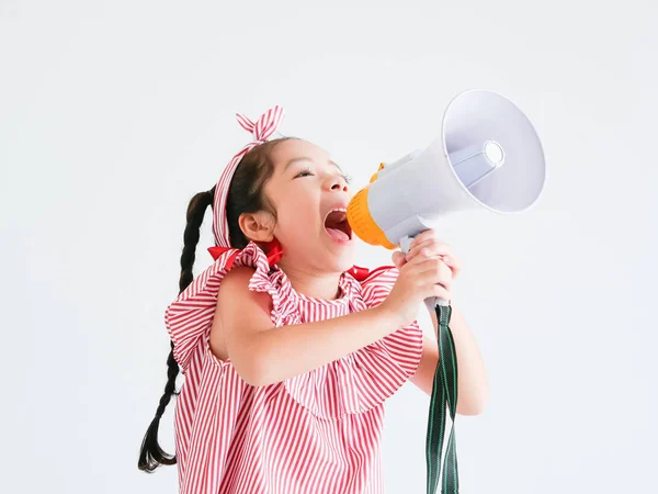 Asian cute girl with megaphone singing on white background — Stock Photo, Image