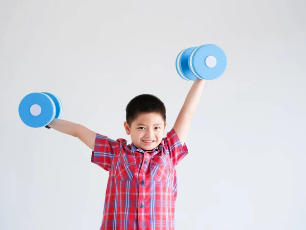 Asian little boy with blue color dumbbell on white background — Stock Photo, Image