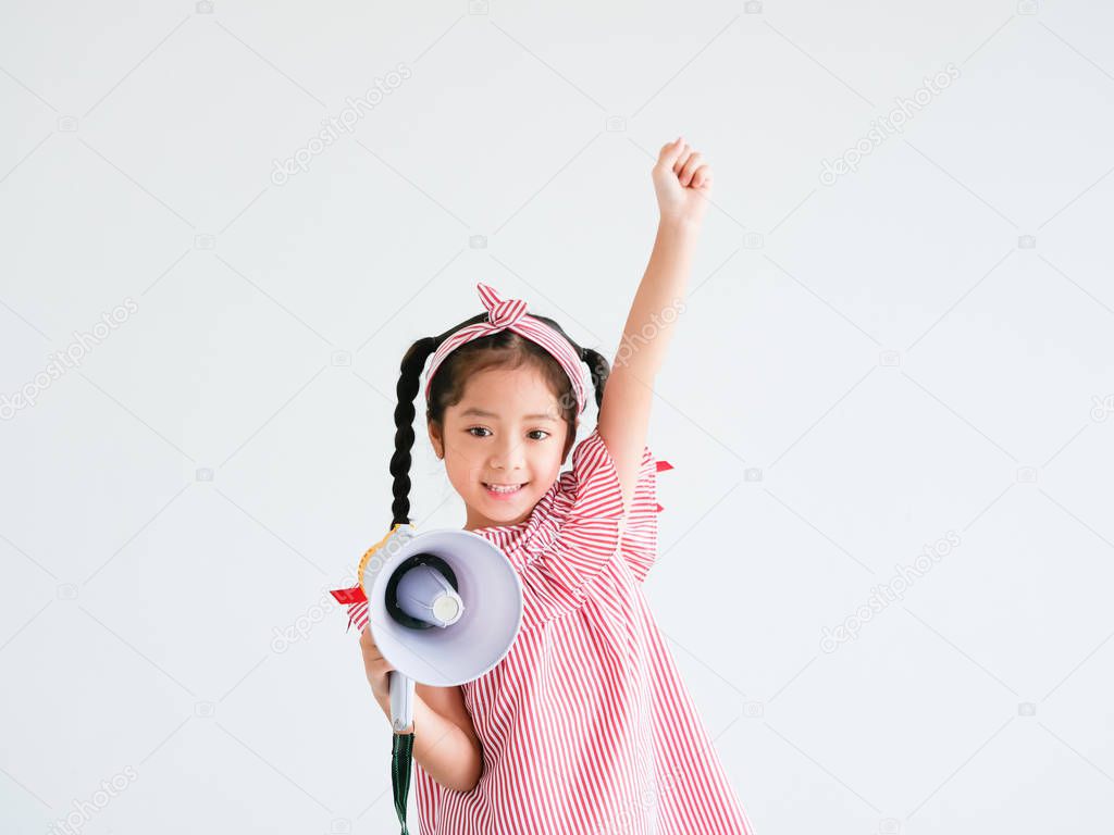 Asian cute girl with megaphone singing on white background
