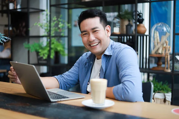 Young Asian Man Blue Shirt Working Laptop Coffee Shop Cafe — Stock Photo, Image