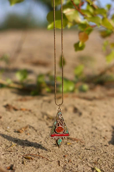 Handmade. Pendant on nature on sunny day — Stock Photo, Image