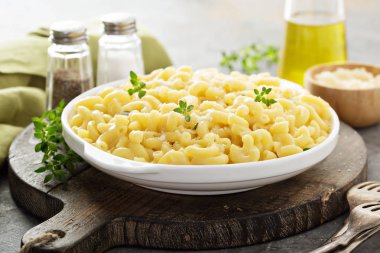Macaroni and cheese on a white plate clipart