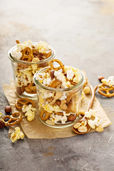 Trail mix with nuts, popcorn and pretzels
