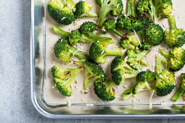 Roasted broccoli on a baking tray