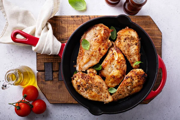 Cooked chicken breast in a skillet