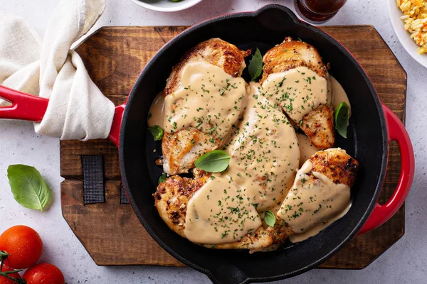 Cooked chicken breast in a skillet — Stock Photo, Image