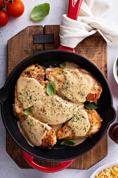 Cooked chicken breast in a skillet