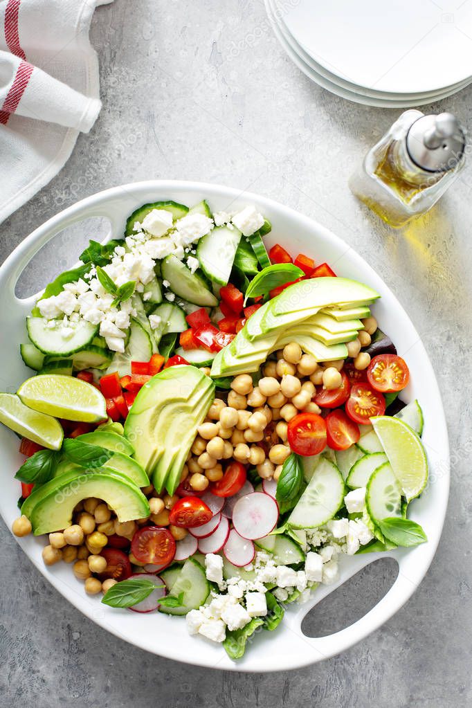 Healthy vegetarian salad with chickpeas, avocado and feta