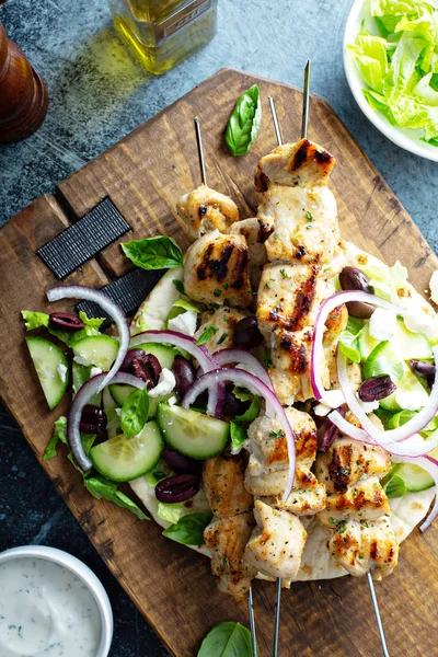 Chicken kebabs on a pita