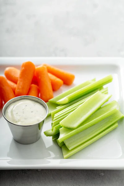 Celery and carrot sticks with ranch