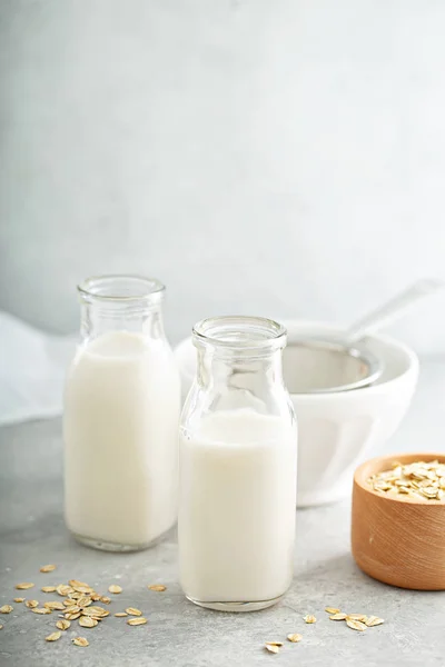 Oat milk in glass bottles — Stock Photo, Image