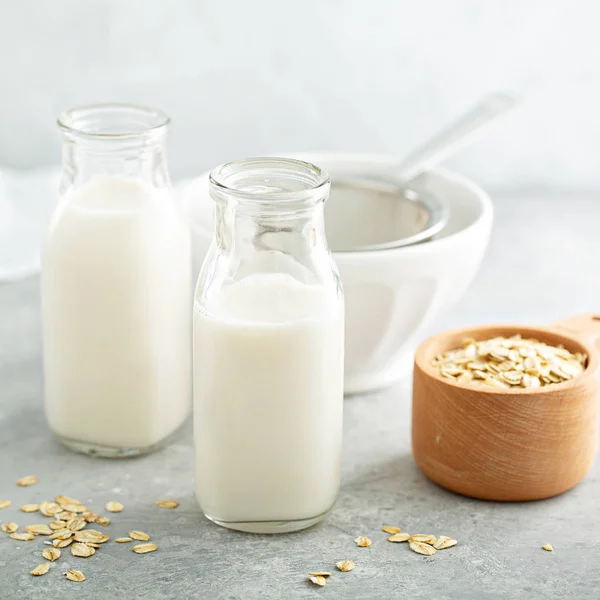 Oat milk in glass bottles — Stock Photo, Image
